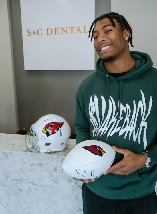 NFL arizona cardinal football player at SNC Dental Clinic in AZ