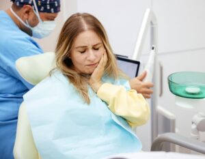  A Woman in Severing with teeth Pain gets a Treatment from the Dentist at S&C dental in Scottsdale AZ.