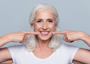 The Woman with White Dental Implants and Beautiful Smile at Scottsdale, AZ