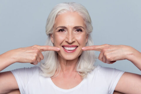 Woman with White Dental Implants and Beautiful Smile